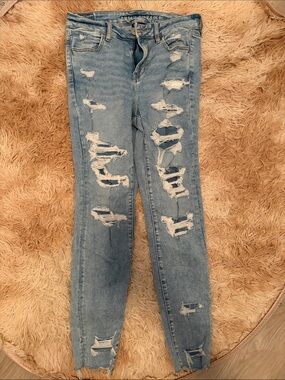 American Eagle Outfitters Next Level Stretch Light Blue Ripped Skinny Jeans